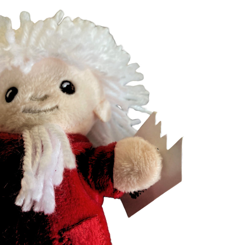 Sandmannpuppe mit rotem Mantel und Schlafsandsäckchen von unten
